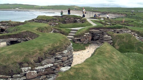 FILE - Visitors look at the 5,000-year-old remains of the village of Skara Brae in the Scottish Orkney Islands, July 19, 2005, which was revealed by a great storm in 1850. Fed up with being ignored by distant politicians, Officials in Scotland's remote Orkney Islands are mulling a drastic solution.  They want to join Norway, the Scandinavian country that gave them as a royal wedding dowry over 550 years ago.  Orkney Council is to discuss options for a 
