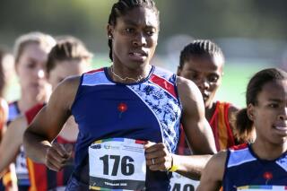 FILE - South African long distance athlete Caster Semenya (176) runs on her way to winning the 5,000 meters at the South African national championships in Pretoria, South Africa, April 15, 2021. A British newspaper has reported that double Olympic champion Semenya said she offered to show her body to track officials when she was just 18 years old to prove she was a female. (AP Photo/Christiaan Kotze/File)