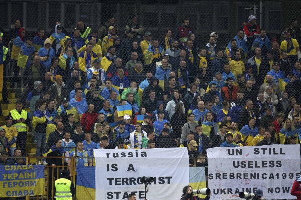 FILE- Ukrainian fans protest during the Euro 2024 playoff soccer match between Bosnia and Ukraine in Zenica, Bosnia, March 21, 2024. (AP Photo/Armin Durgut, File)
