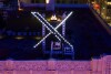 File - Workers install lighting on an "X" sign atop the company headquarters, formerly known as Twitter, in San Francisco, on July 28, 2023. Before it transformed into X, Twitter was the place to turn to for live and reliable information about big news events, from wars to natural disasters. But as the Israel-Hamas war has underscored, that is no longer the case. (AP Photo/Noah Berger, File)