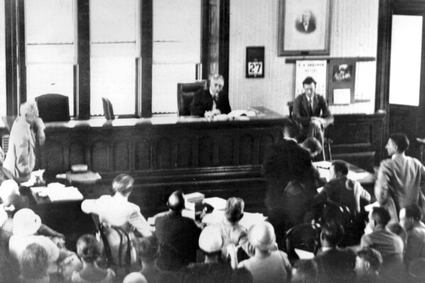 Col. Charles A. Lindbergh testifies on the witness stand at the courthouse in Flemington, N.J., on June 27, 1932.  Lindbergh is testifying against John Hughes Curtis, Norfolk shipbuilder, who is accused of hoaxing authorities during the Lindbergh kidnapping case.  Col. Lindbergh  told of his negotiations with Curtis, who had told Lindbergh that he had been in contact with the kidnappers who took the Lindbergh baby.  (AP Photo)