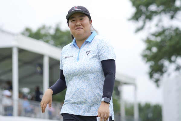 Ruixin Liu, of China, smiles as he walks off the 18th green during the first round of the LPGA Tour Kroger Queen City Championship golf tournament in Cincinnati, Thursday, Sept. 7, 2023. (AP Photo/Aaron Doster)
