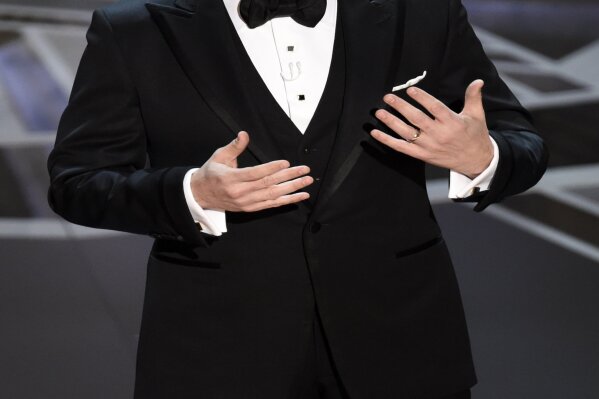 
              Host Jimmy Kimmel speaks at the Oscars on Sunday, March 4, 2018, at the Dolby Theatre in Los Angeles. (Photo by Chris Pizzello/Invision/AP)
            