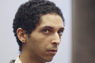 
              FILE - In this May 22, 2018, file photo, Tyler Barriss, of California, appears for a preliminary hearing in Wichita, Kan. Barriss, who pleaded guilty to 51 charges related to fake emergency calls and threats will be sentenced in federal court in Wichita, Friday, March 29, 2019, and could face decades in prison. His case drew national attention to the practice of "swatting," a form of retaliation in which gamers get police to go to an online opponent's address. One hoax emergency call by Barris led police to fatally shoot a Kansas man. (Bo Rader/The Wichita Eagle via AP, File)
            