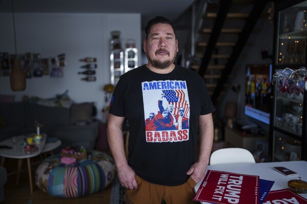 Juergen Boasson, Trump's fan posting for photo in his house in Nuuk, Greenland, March 7, 2025. (AP Photo/Evgeniy Maloletka)