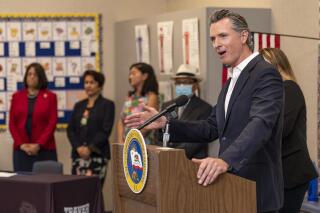 California Gov. Gavin Newsom speaks at Traver Joint Elementary School on Tuesday, July 20, 2021, in Traver, Calif. He and officials from other counties discussed the state's plan to achieve equitable statewide access to high-speed broadband internet service. The bill includes $6 billion towards broadband expansion throughout California. (Ron Holman/The Times-Delta via AP)