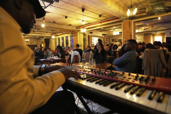 Diners watch the resident band perform at The Marabi Club in downtown Johannesburg, South Africa, Friday, May 9, 2025. (AP Photo/Themba Hadebe)