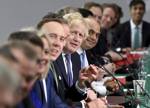Britain's Prime Minister Boris Johnson, centre, as he chairs a Cabinet meeting, convened in the National Glass Centre at University of Sunderland, in Sunderland, England, Friday Jan. 31, 2020.  Sunderland was the first city to declare its support for Brexit when results were announced after the 2016 referendum.  On the stroke of 23:00 GMT on Friday Jan. 31, 2020, Britain will leave the European Union after 47-years of membership, and they have until the end of the year to forge a new relationship with the bloc. (Paul Ellis/PA via AP)