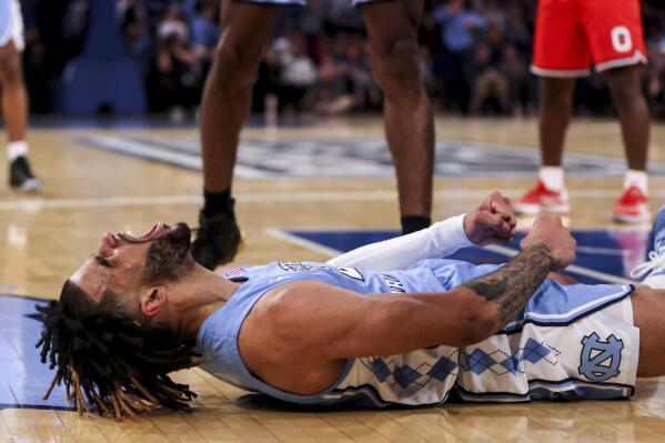 North Carolina guard R.J. Davis celebrates a shot during the second half of an NCAA college basketball game against Ohio State in the CBS Sports Classic, Saturday, Dec. 17, 2022, in New York. The Tar Heels won 89-84 in overtime. (AP Photo/Julia Nikhinson)