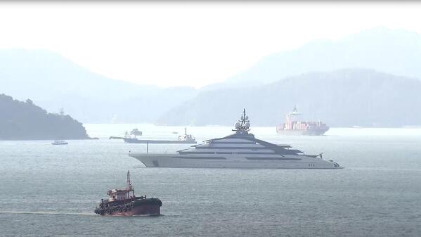 FILE - In this image taken from a video footage run by TVB, the megayacht Nord, center, worth over $500 million, is seen off Hong Kong Island outside Victoria Harbour on Friday, Oct. 7, 2022. The Nord, linked to sanctioned Russian tycoon Alexey Mordashov, left Hong Kong for South Africa Thursday, Oct. 20, 2022, nearly two weeks after the U.S. chastised the city for operating as a “safe haven” for sanctioned individuals. (TVB via AP, File)
