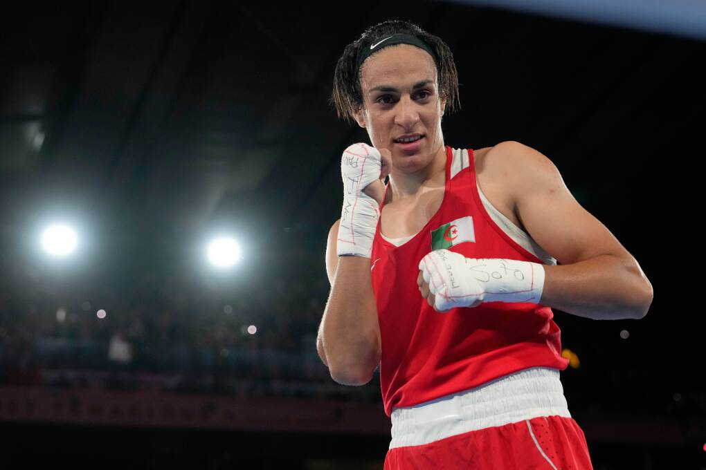 Algeria's Imane Khelif poses after defeating China's Yang Liu to win gold in their women's 66 kg final boxing match at the 2024 Summer Olympics, Friday, Aug. 9, 2024, in Paris, France. (AP Photo/Ariana Cubillos, File)