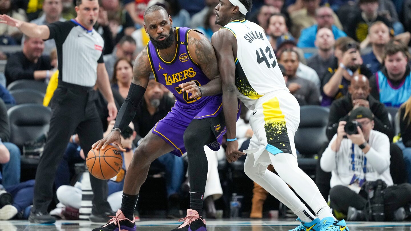 LeBron James beats buzzer with tip to lift Lakers past Pacers and keep record streak alive