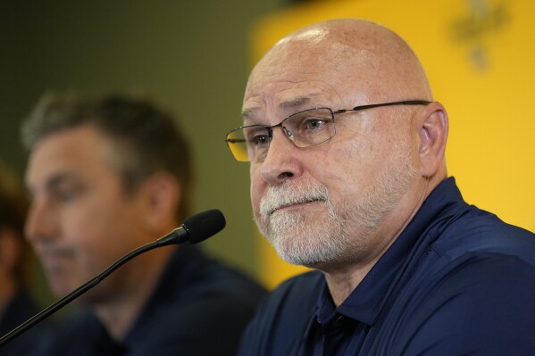 FILE -Nashville Predators incoming general manager Barry Trotz responds to questions during a news conference at the NHL hockey team's arena Wednesday, May 31, 2023, in Nashville, Tenn. Barry Trotz never put a label on whether he was rebuilding, retooling or simply trying to reset the Nashville Predators during his first season as general manager. (AP Photo/George Walker IV, File)