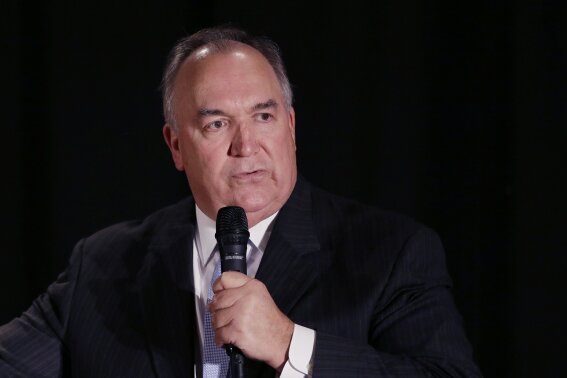 
              FILE - In this Oct. 13, 2014, file photo, former Michigan Gov. John Engler speaks during a Republican rally in Troy, Mich. A high-ranking Michigan State University official involved in the board of trustees' plan says former Gov. Engler will be named interim president. The official told The Associated Press that the board will vote to hire Engler on Wednesday, Jan. 31, 2018, amid the fallout over sexual assaults committed by former school sports doctor Larry Nassar. (AP Photo/Carlos Osorio File)
            