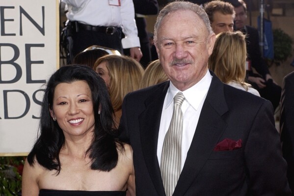 Actor Gene Hackman arrives with his wife, Betsy Arakawa, for the 60th Annual Golden Globe Awards in Beverly Hills, Calif., Sunday, Jan. 19, 2003. (AP Photo/Mark J. Terrill, File)