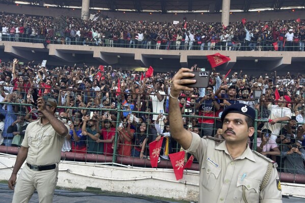 Fans gather to celebrate Royal Challengers Bengaluru cricketers, winners of the Indian Premier League, at the M. Chinnaswamy Stadium in Bengaluru, India, Wednesday, June 4, 2025. (AP Photo/Aijaz Rahi)