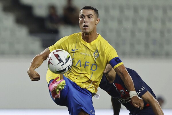 FILE - Al Nassr's Cristiano Ronaldo controls the ball during a friendly soccer match against Paris Saint-Germain in Osaka, western Japan, on July 25, 2023. Cristiano Ronaldo has come under heavy criticism after seemingly making an offensive gesture following Al Nassr鈥檚 3-2 victory over Al Shabab in a Saudi Pro League match on Sunday, Feb. 25, 2024. (Kyodo News via AP, File)