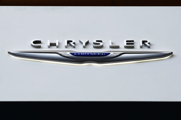 FILE - The Chrysler logo is on display at the Pittsburgh International Auto Show, Feb. 11, 2016, in Pittsburgh. On Saturday, June 8, 2024, the National Highway Traffic Safety Administration announced that Chrysler is recalling more than 211,000 SUVs and pickup trucks in the U.S., due to a software malfunction that could disable the cars' electronic stability control systems. (AP Photo/Gene J. Puskar, File)