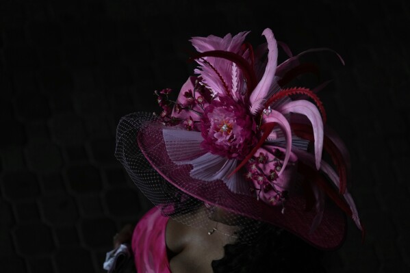 A race fan walks though a tunnel at Churchill Downs before the 151st running of the Kentucky Oaks horse race Friday, May 2, 2025, in Louisville, Ky. (AP Photo/Brynn Anderson)