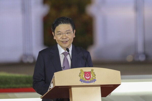 In this photo released by Singapore's Ministry of Communications and Information, Singapore's new Prime Minister Lawrence Wong makes a speech after being sworn in at the Istana in Singapore, Wednesday, May 15, 2024. Wong was sworn in Wednesday as the nation's fourth prime minister in a carefully planned political succession designed to ensure continuity and stability in the Asian financial hub. (Ministry of Communications and Information via AP)