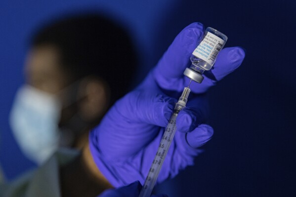 FILE - Family nurse practitioner Carol Ramsubhag-Carela prepares a syringe with the Mpox vaccine before inoculating a patient at a vaccinations site on, Aug. 30, 2022, in the Brooklyn borough of New York. (AP Photo/Jeenah Moon, File)