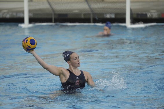 U.S. Women's Water Polo player Ella Woodhead practices during a training session at Long Beach City College, Thursday, Jan. 18, 2024, in Long Beach, Calif. The U.S. water polo teams for the Olympics could have a much deeper connection than just a mutual love of their grueling sport. Chase and Ryder Dodd are trying to make the men's roster, alongside another pair of brothers in Dylan and Quinn Woodhead. Ella Woodhead, Dylan and Quinn's sister, is in the mix for the loaded women's squad. The Woodheads are from Northern California, and the Dodds grew up in Southern California. There are a couple more siblings in different sports who also could be competing in Paris this summer. (AP Photo/Damian Dovarganes)