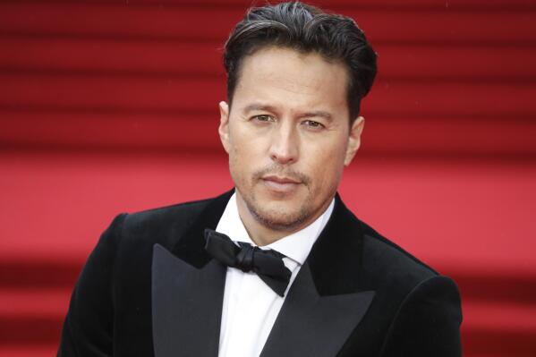 Cary Joji Fukunaga poses for photographers upon arrival for the World premiere of the new film from the James Bond franchise 'No Time To Die', in London Tuesday, Sept. 28, 2021. (Photo by Vianney Le Caer/Invision/AP)