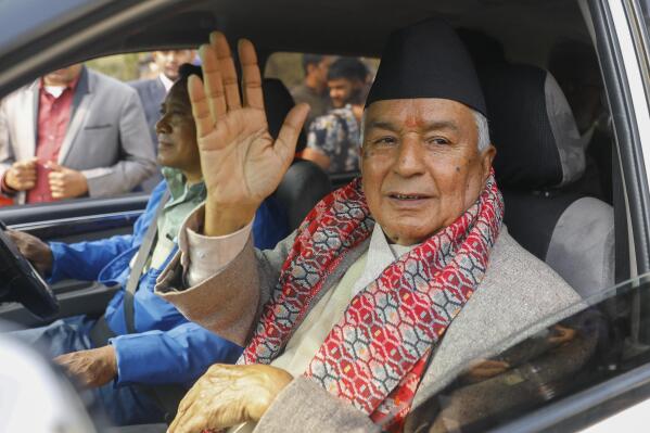 Ram Chandra Poudel of the Nepali Congress party waves after filling his nomination to become Nepal's next president as in Kathmandu, Nepal, Saturday, February 25, 2023. (AP Photo/Bikram Rai)