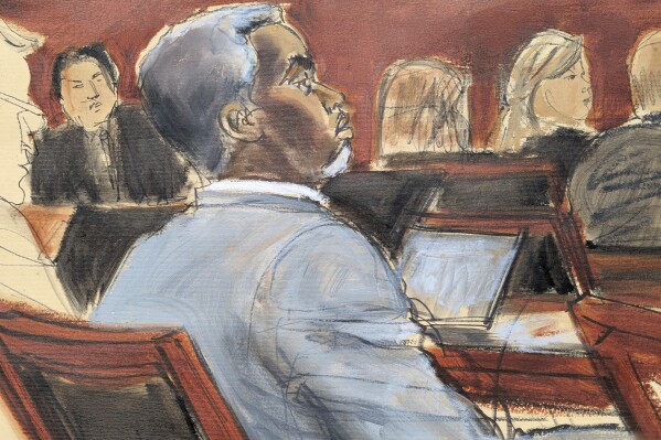 Sean Diddy Combs listens during opening statements on the first day of trial in Manhattan federal court, Monday, May 12, 2025, in New York. (Elizabeth Williams via AP)
