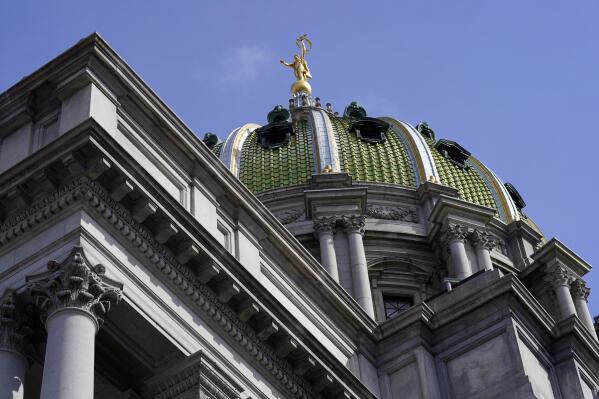 FILE - Pennsylvania Capitol in Harrisburg, Pa., on April 4, 2022. Pennsylvania voters on Tuesday, Nov. 8, will send dozens of new representatives and senators to the Legislature, thanks to a slew of retirements and new district maps that were revamped by the state's redistricting commission. (AP Photo/Matt Rourke, File)