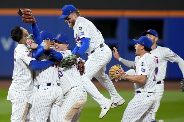 Francisco Lindor's grand slam sends Mets into NLCS with 4-1 win over Phillies in Game 4 of NLDS | AP News