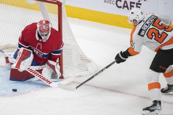 Philadelphia Flyers' James van Riemsdyk shoots on Montreal Canadiens goaltender Carey Price during the third period of an NHL hockey game Thursday, April 21, 2022, in Montreal. (Graham Hughes/The Canadian Press via AP)