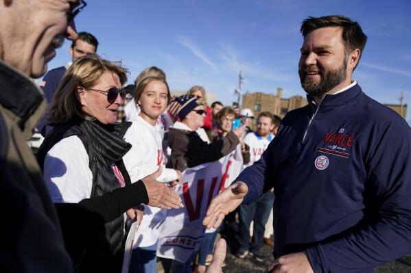 Ohio Senate candidate JD Vance meets with supporters after casting his ballot at a polling location in Cincinnati, Tuesday, Nov. 8, 2022. (AP Photo/Jeff Dean)
