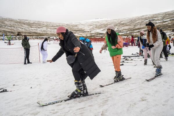 First time skiers take a lesson at the Afriski ski resort near Butha-Buthe, Lesotho, Saturday July 30, 2022. While millions across Europe sweat through a summer of record-breaking heat, Afriski in the Maluti Mountains is Africa's only operating ski resort south of the equator. It draws people from neighboring South Africa and further afield by offering a unique experience to go skiing in southern Africa. (AP Photo/Jerome Delay)