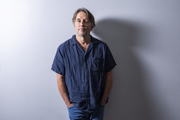 Richard Linklater poses for a portrait to promote the film "Hit Man" during the Toronto International Film Festival, Sunday, Sept. 10, 2023, in Toronto. (Photo by Joel C Ryan/Invision/AP)