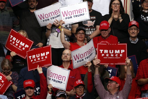 FILE - Supporters cheer as President Donald Trump speaks at a campaign rally, Feb. 20, 2020, in Colorado Springs, Colo. A Colorado judge on Thursday, July 18, 2024, rejected claims from civil and voting rights organizations that a group of Donald Trump supporters intimidated voters when they went door-to-door searching for fraud following the 2020 election. (AP Photo/David Zalubowski, File)