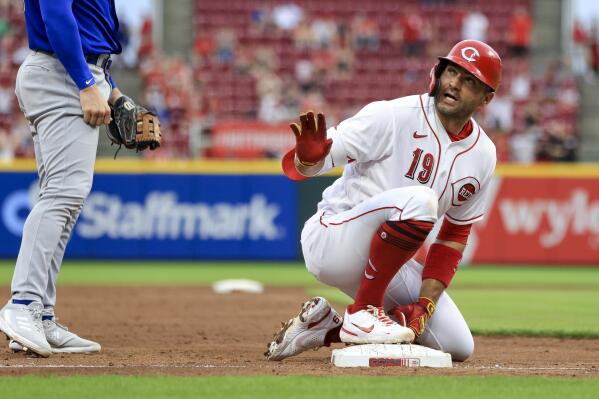 Cincinnati Reds' Joey Votto gestures for a timeout after hitting a two-run triple against the Chicago Cubs during the third inning of a baseball game in Cincinnati, Wednesday, May 25, 2022. (AP Photo/Aaron Doster)