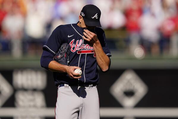 Atlanta Braves starting pitcher Charlie Morton (50) wipes his face during the second inning in Game 4 of baseball's National League Division Series between the Philadelphia Phillies and the Atlanta Braves, Saturday, Oct. 15, 2022, in Philadelphia. (AP Photo/Matt Slocum)