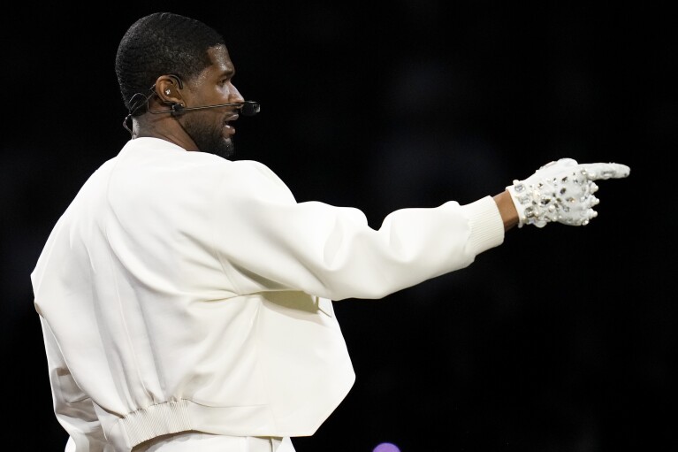 Usher performs during halftime of the NFL Super Bowl 58 football game between the San Francisco 49ers and the Kansas City Chiefs on Sunday, February 11, 2024, in Las Vegas.  (AP Photo/Ashley Landis)
