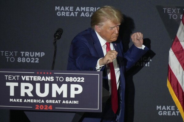 Republican president candidate former President Donald Trump dances at the conclusion of his remarks at a campaign rally, Tuesday Aug. 8, 2023, at Windham High School in Windham, N.H. (AP Photo/Robert F. Bukaty)