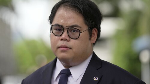 Student activist Bunkueanun Paothong arrives at a criminal court in Bangkok, Thailand, Wednesday, June 28, 2023. A court in Thailand on Wednesday acquitted the student activist and four other people of impeding the motorcade of the country’s queen during pro-democracy demonstrations in 2020, an offense that could have seen them sentenced to 16 years in jail or even the death penalty. (AP Photo/Sakchai Lalit)