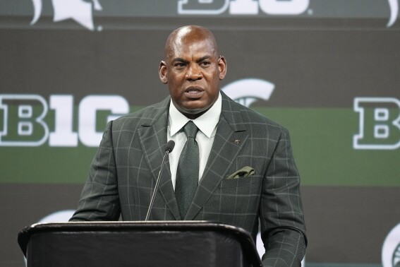 FILE - Michigan State head coach Mel Tucker speaks during an NCAA college football news conference at the Big Ten Conference media days at Lucas Oil Stadium, Wednesday, July 26, 2023, in Indianapolis. ichigan State athletic director Alan Haller has informed suspended football coach Mel Tucker he is being fired for cause without compensation for his conduct with activist and rape survivor Brenda Tracy. “The notice provides Tucker with seven calendar days to respond and present reasons to me and the interim president as to why he should not be terminated for cause,” Haller said in a statement sent by the school on Monday, Sept. 18.(AP Photo/Darron Cummings, File)