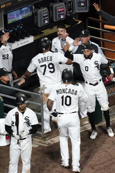 Jose Abreu and Yoan Moncada of the Chicago White Sox celebrate a win