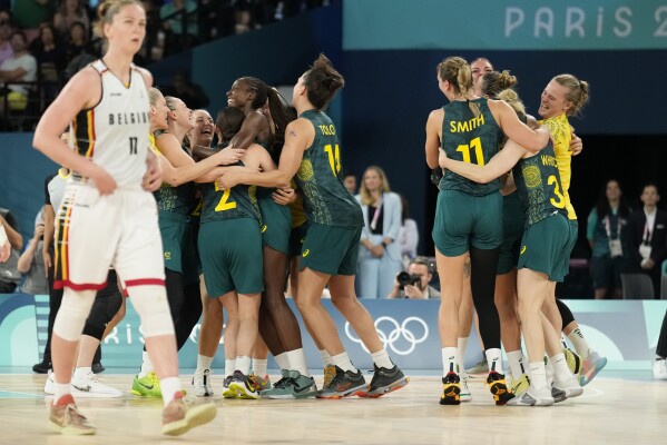 Australia celebrates after a women's bronze medal basketball game at Bercy Arena at the 2024 Summer Olympics, Sunday, Aug. 11, 2024, in Paris, France. (AP Photo/Mark J. Terrill)
