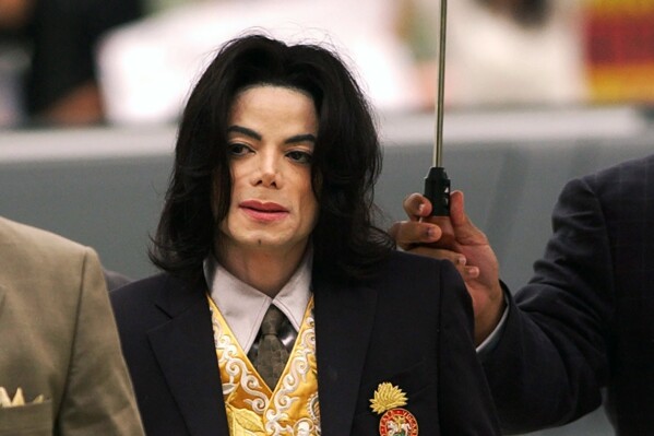 FILE - Michael Jackson arrives at the Santa Barbara County Courthouse for his child molestation trial in Santa Maria, Calif., May 25, 2005. A California appeals court on Friday, Aug. 18, 2023, revived lawsuits from two men who allege Michael Jackson sexually abused them for years when they were boys. (Aaron Lambert/The Santa Maria Times via AP, Pool, File)