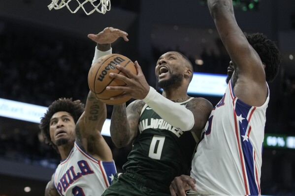 Lillard sets Bucks record with 39 points in a debut, leads Milwaukee past Philadelphia 118-117 | AP News