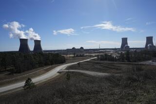 FILE - Georgia Power Co.'s Plant Vogtle nuclear power plant is seen, Jan. 20, 2023, in Waynesboro, Ga., with two older reactors on the left and two new reactors on the right. Georgia Power announced Monday, May 1, that the second new reactor had completed a testing phase, getting closer to generating electricity. (AP Photo/John Bazemore, File)