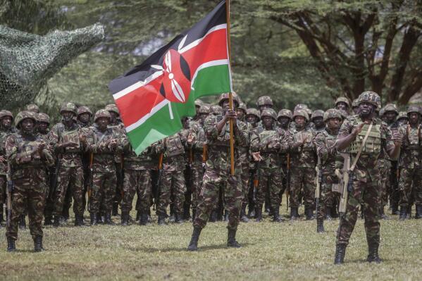 Members of the Kenya Defence Forces (KDF) take part in a flag-handover ceremony, ahead of a future deployment to eastern Congo as part of the newly-created East African Community Regional Force (EACRF), at the Embakasi garrison in Nairobi, Kenya Wednesday, Nov. 2, 2022. Kenya is sending more than 900 military personnel to eastern Congo to join a new regional force trying to calm deadly tensions fueled by armed groups that have led to a diplomatic crisis between Congo and neighboring Rwanda. (AP Photo/Brian Inganga)