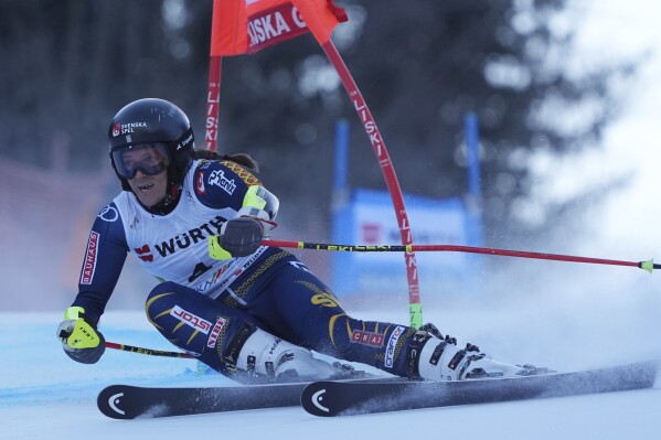 Sweden's Sara Hector speeds down the course during an alpine ski, women's World Cup giant slalom race in Kranjska Gora, Slovenia, Saturday, Jan. 4, 2025. (AP Photo/Giovanni Auletta)