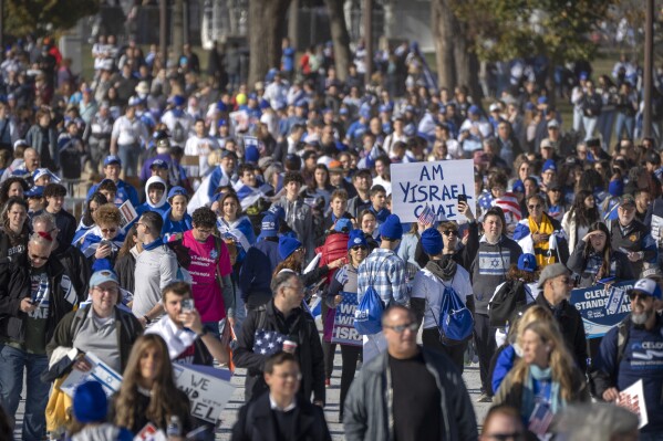 Participants arrive at the March for Israel at the National Mall on Tuesday, Nov. 14, 2023, in Washington. (AP Photo/Mark Schiefelbein)